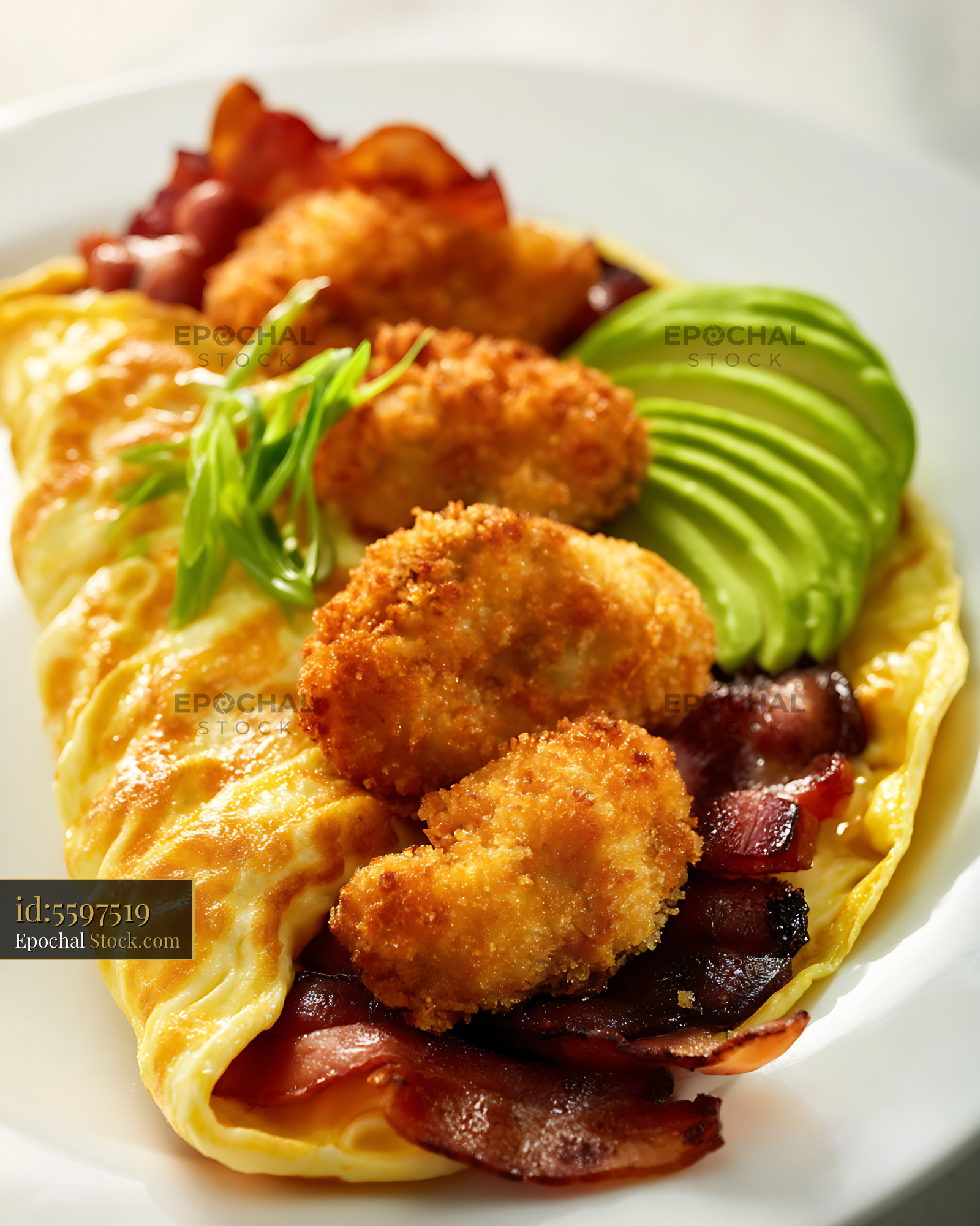 Breaded Shrimp Omelet with Avocado & Bacon - stock photo