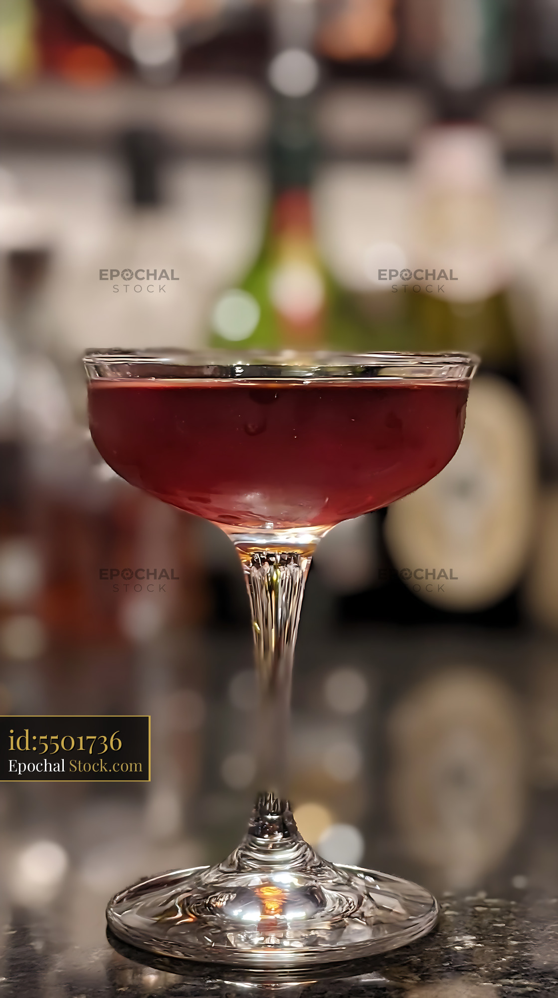 Bushwick Cocktail in Coupe Glass at Bar - stock photo