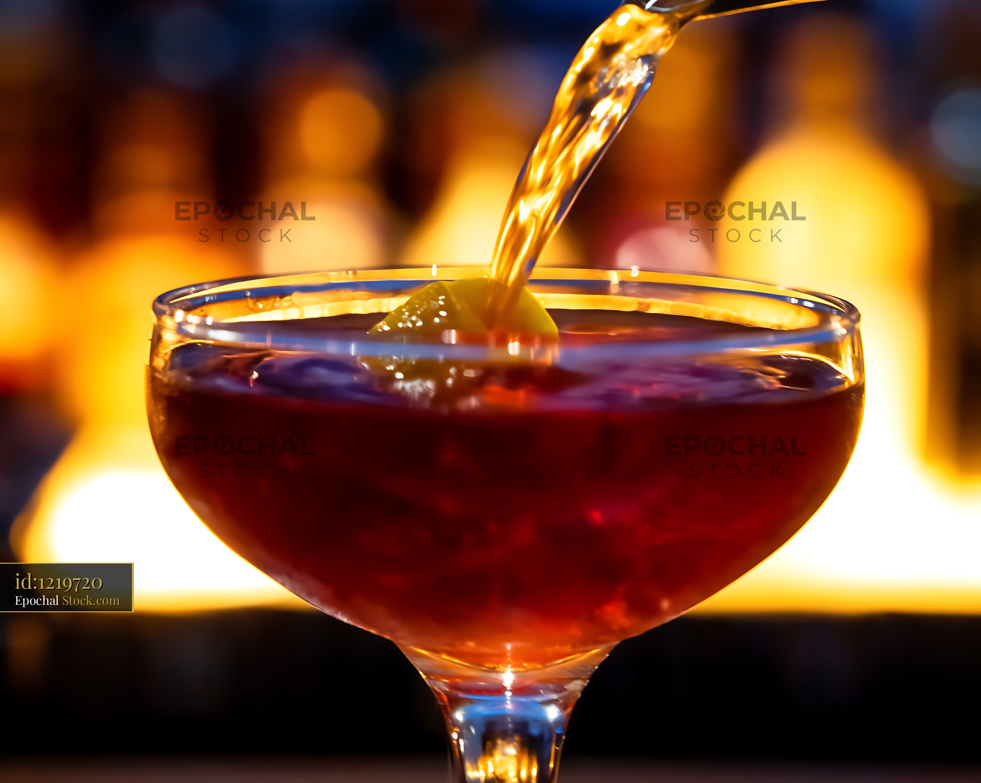 Bushwick Cocktail Pouring Into Coupe Glass - stock photo