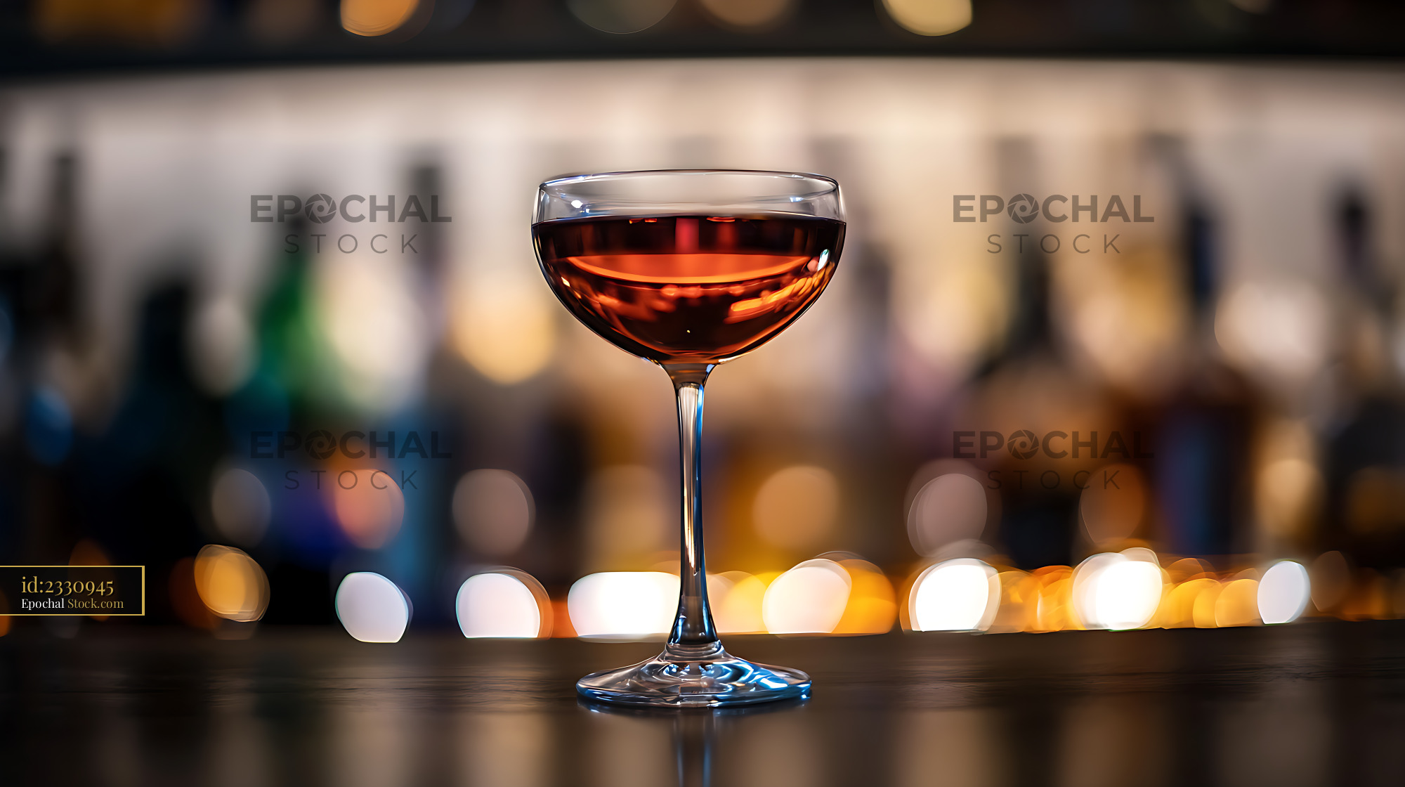Cocktail Served in Coupe Glass at Bar - stock photo