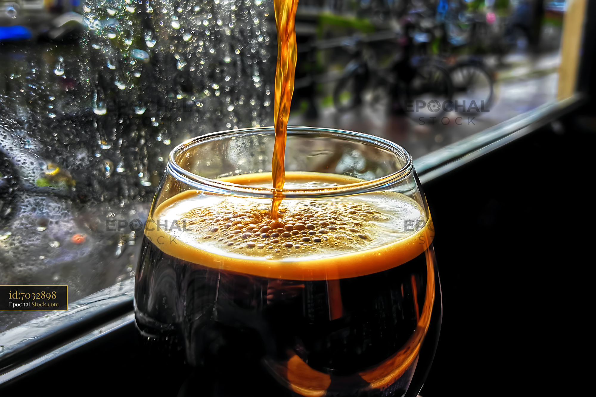 Nitro Caramel Coffee Pouring Into Glass - stock photo