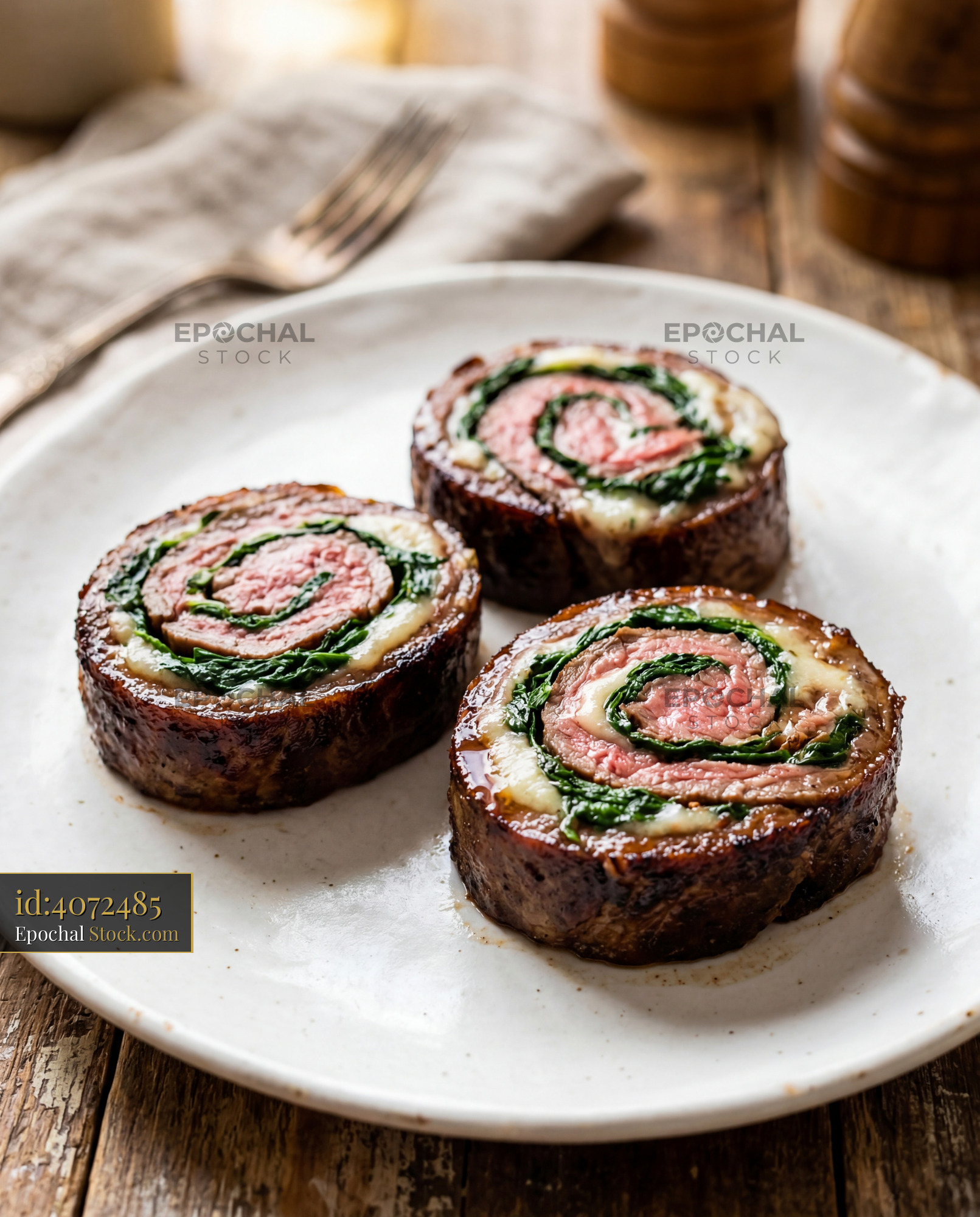 Seared Beef Roulade with Wilted Spinach Filling - stock photo