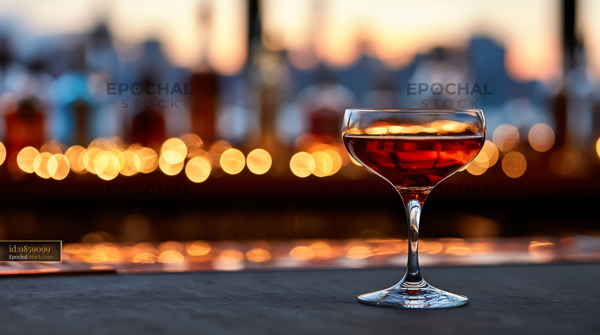 Elegant Red Cocktail on Rooftop Bar at Sunset - stock photo
