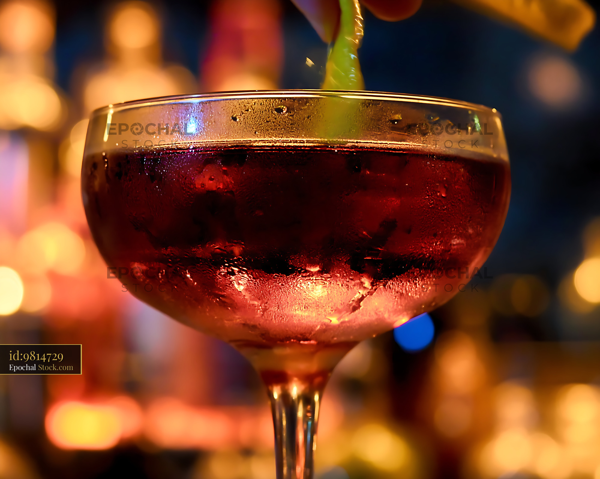 Bushwick Cocktail with Lime Twist at Bar - stock photo