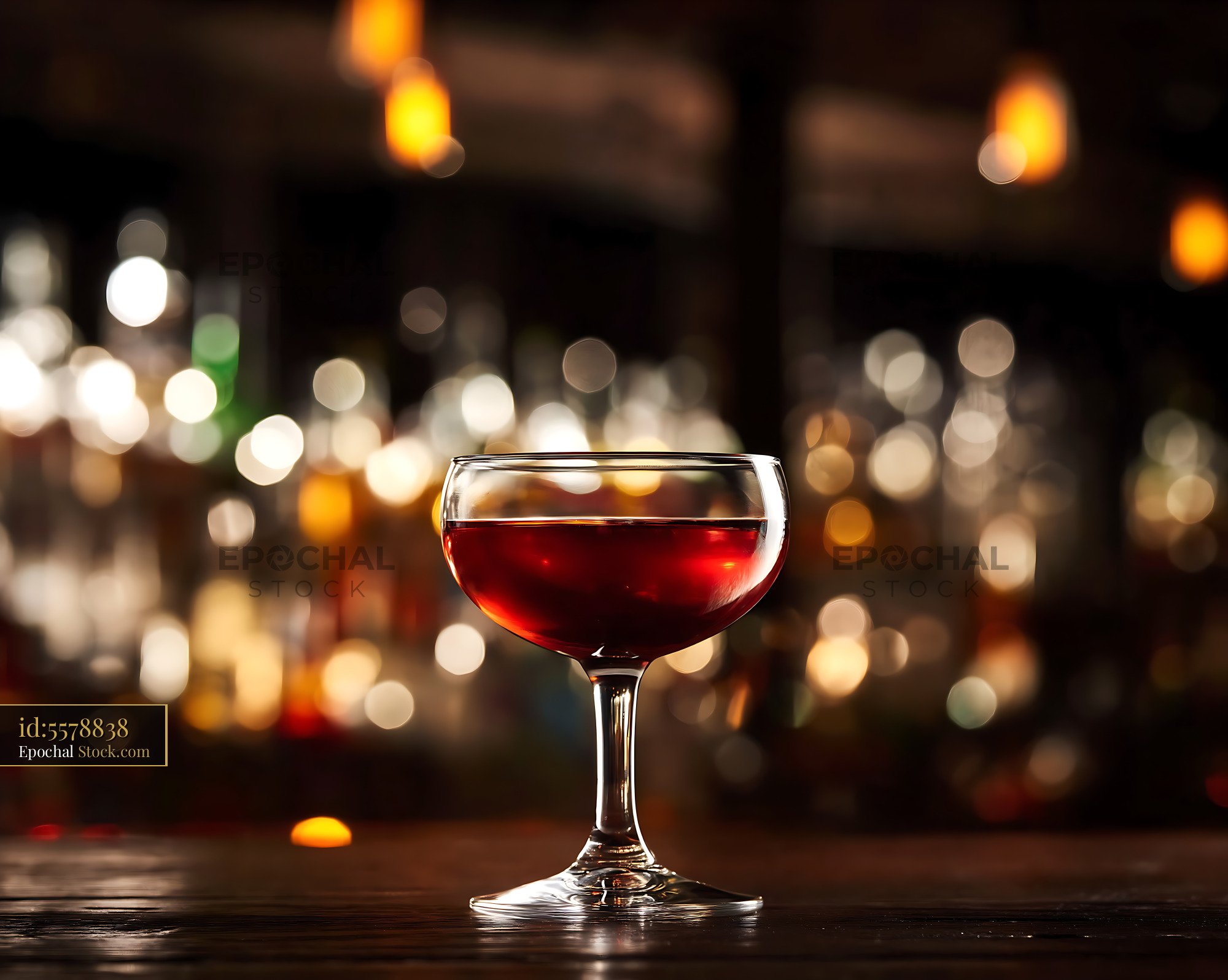 Bushwick Cocktail in Coupe Glass at Bar - stock photo