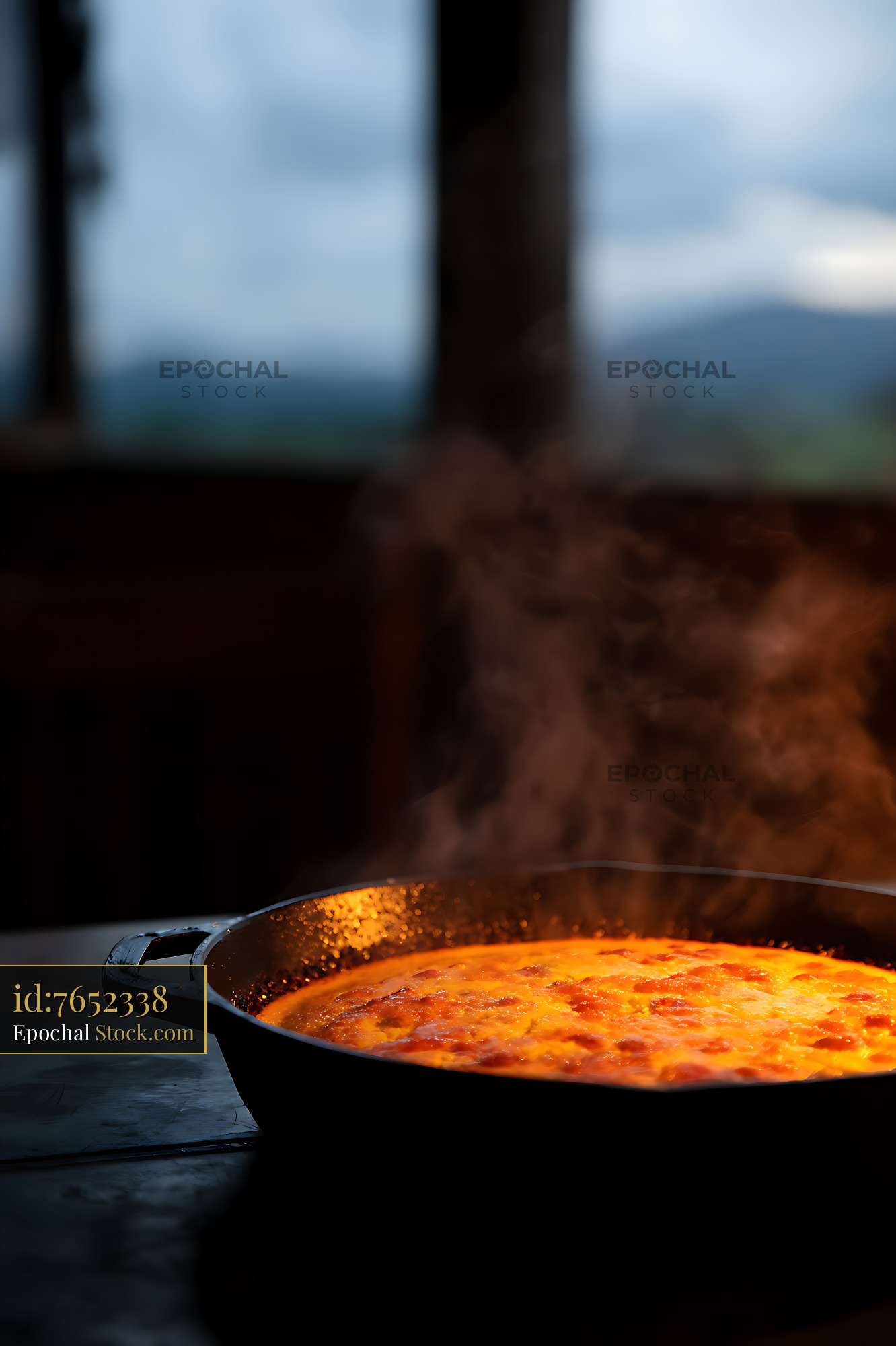 Golden Cast Iron Pan Steaming Mountain Lodge Dinner - stock photo