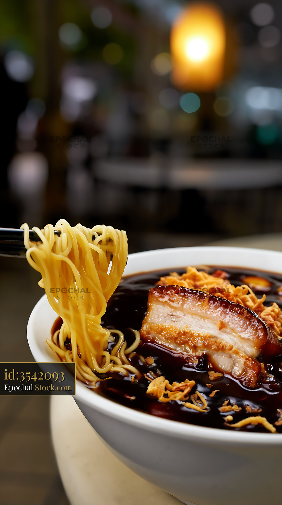 Chopsticks Lifting Noodles from Rich Lor Mee Soup Bowl - stock photo