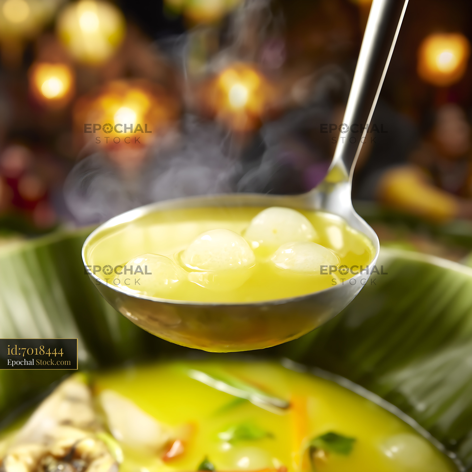 Steaming Kapurung Soup Ladled from Banana Leaf Bowl - stock photo