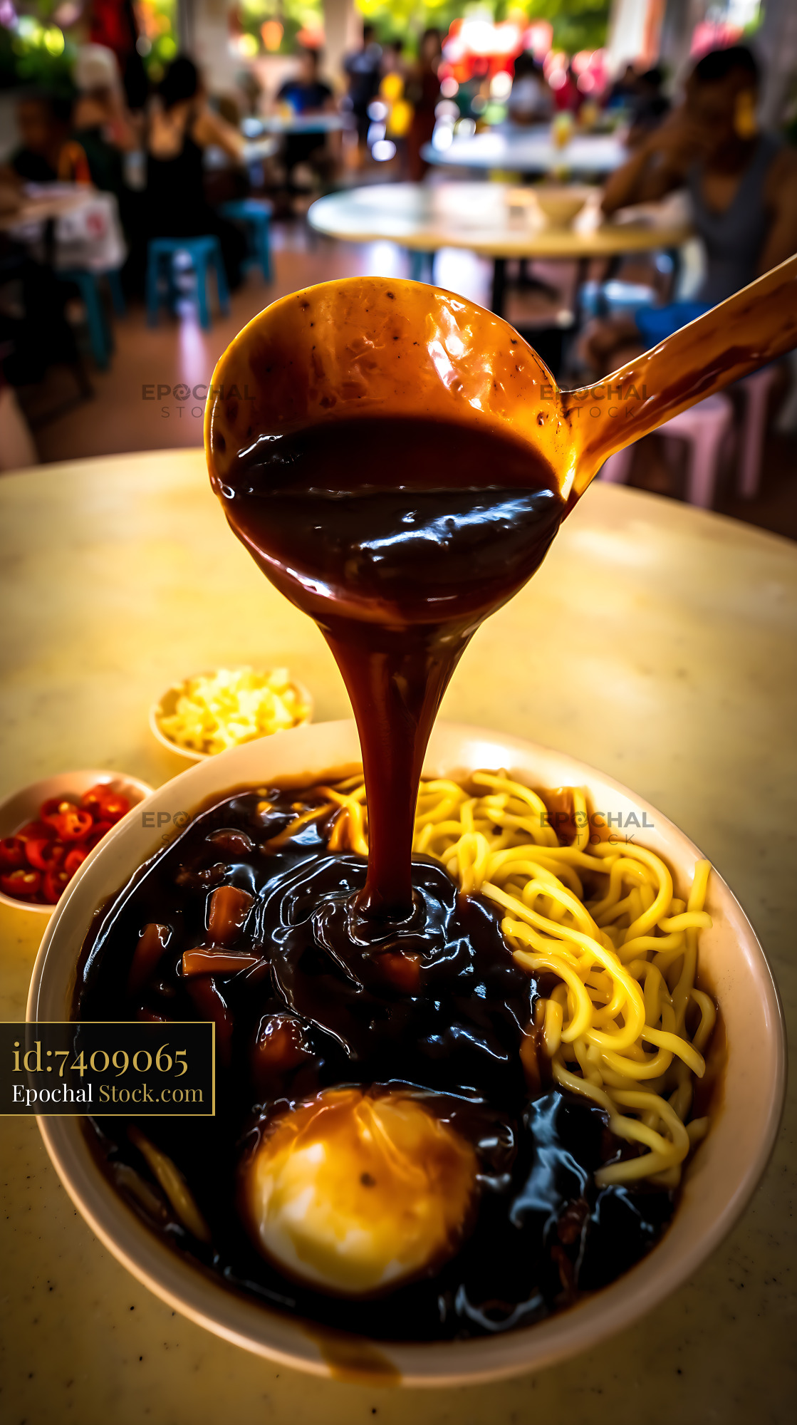 Lor Mee Soup Poured onto Noodles in Busy Eatery - stock photo