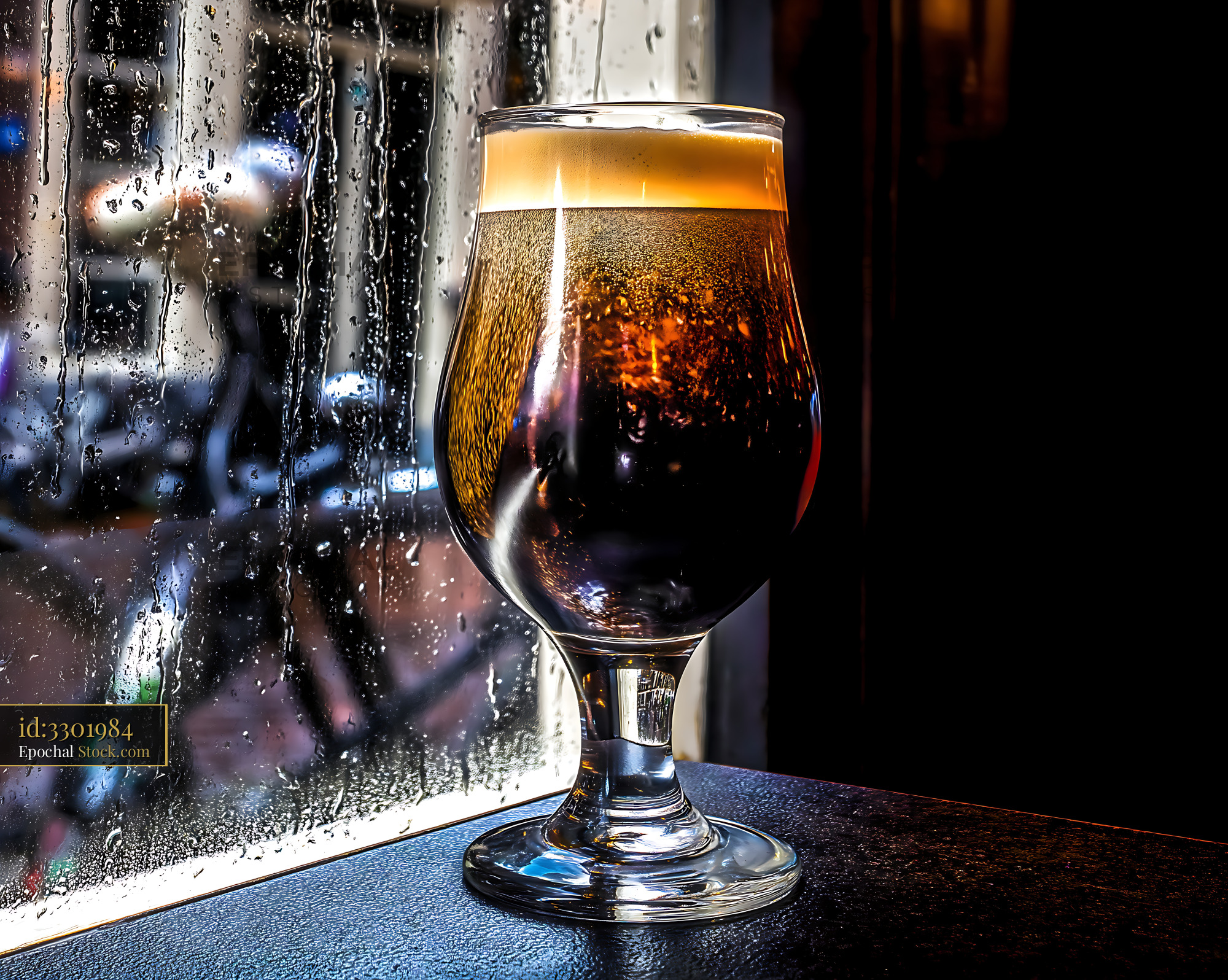 Iced Nitro Caramel Coffee with Rainy Backdrop - stock photo