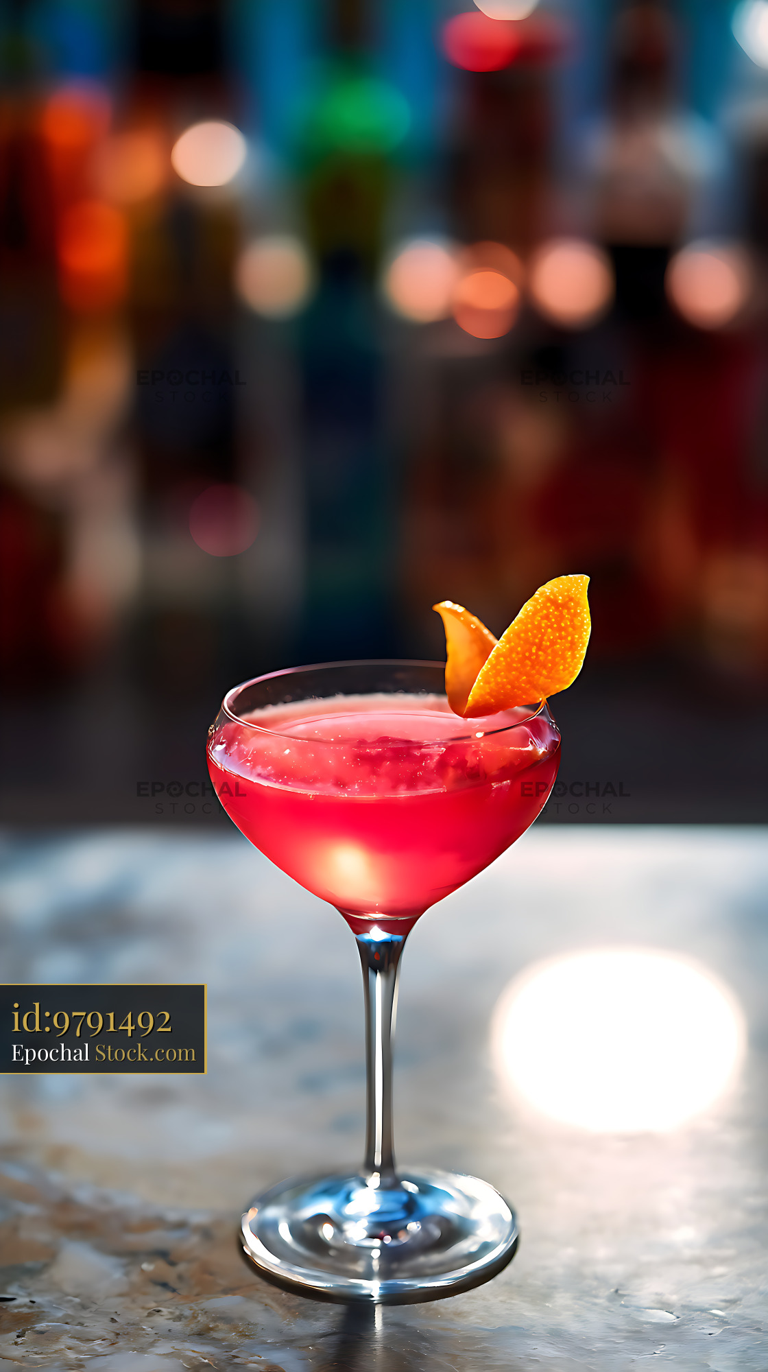 Red Cocktail with Orange Peel Garnish - stock photo